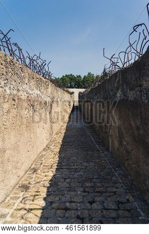 08.27.2022 - Belzec, Poland - Belzec Nazi Death Camp. Weathered Stone Walls Of Former Nazi Death Cam
