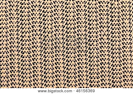 Grille en caoutchouc beige dentelle sur fond noir