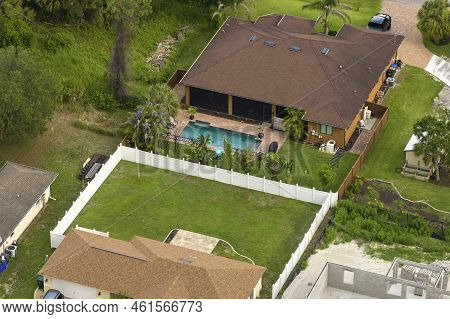 Aerial View Of Typical Contemporary American Private House With Roof Top Covered With Asphalt Shingl