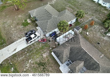 Aerial View Of Typical Contemporary American Private House With Roof Top Covered With Asphalt Shingl