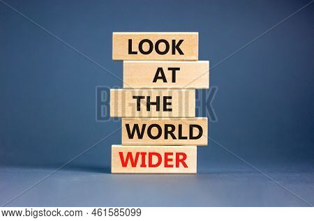 Look At The World Wider Symbol. Concept Words Look At The World Wider On Wooden Blocks On A Beautifu