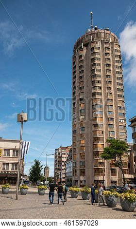 Europe, France, Dunkerque - July 9, 2022: Tall Cylinder Beige Office And Residential Building On Se 