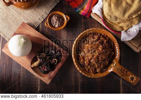 Tinga De Res. Typical Mexican Dish Prepared Mainly With Shredded Beef, Onion And Dried Chilies. It I