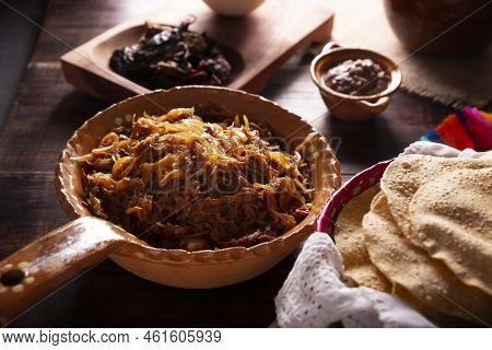 Tinga De Res. Typical Mexican Dish Prepared Mainly With Shredded Beef, Onion And Dried Chilies. It I