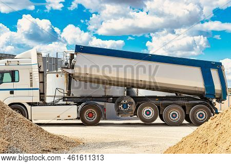 Large Dump Truck Near The Concrete Factory. Car Tonar For Transportation Of Heavy Bulk Cargo. Provis