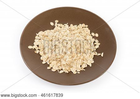 Uncooked Thick-rolled Oats On The Brown Dish On A White Background