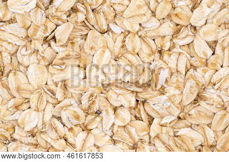 Evenly Sprinkled Raw Thick-rolled Oats Close-up, Background