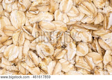 Evenly Sprinkled Raw Thick-rolled Oats, Top View Close-up, Background, Texture