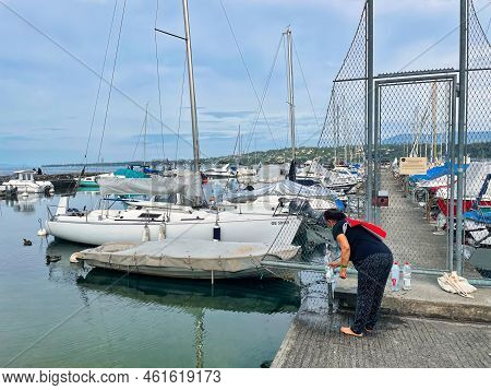 Geneva, Switzerland - September 14 2021: Luxurious And Expensive Yachts Are Docked In A Harbor On La
