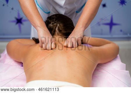 Facial Massage. A Woman Is Given A Massage In A Beauty Salon. Close-up.