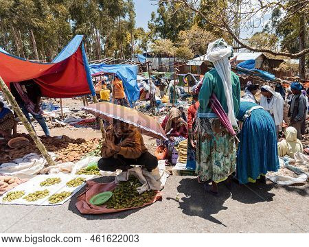 Debre Libanos, Ethiopia - April 19, 2019: Ordinary Ethiopian Woman Sell Fruits And Vegetables At A S