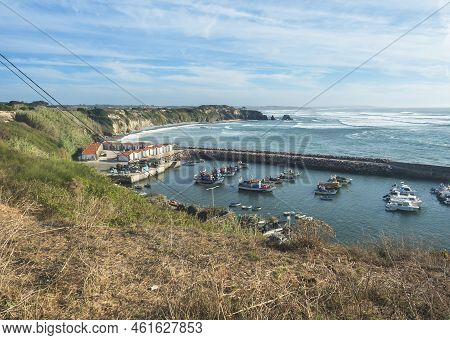 View Of The Portinho Do Canal, Marina And Dock With Fishermans Boats Anchored In Protected Calm Bay 