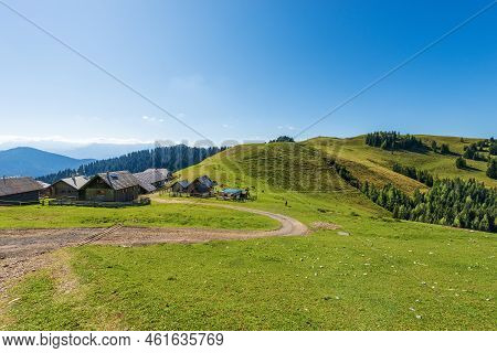 Small Village Below The Mountain Peak Of The Osternig Or Oisternig On A Sunny Summer Day, Italy-aust