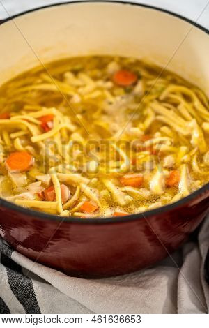 Cooking Chicken Noodle Soup With Kluski Noodles In An Enameled Dutch Oven.