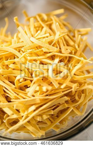 Measured Ingredients In Glass Mixing Bowls To Make Chicken Noodle Soup With Kluski Noodles.