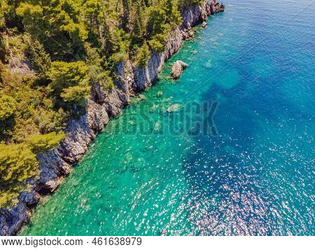 Picturesque Sea Adriatic Coast Of Montenegro. Turquoise Mediteran Sea And Rocky Shore With Evergreen