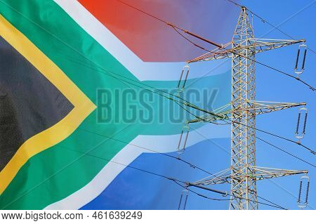 South Africa Flag On Electric Pole Background. Power Shortage And Increased Energy Consumption In So