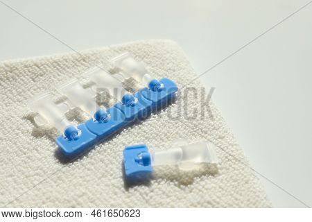 Single Dose Eye Drops And Towel On White Table, Closeup