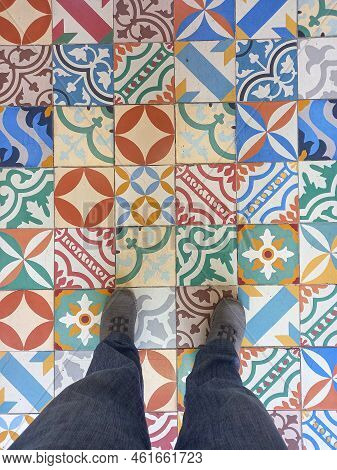Human Leg With Ceramic Tile Texture Background In Oriental Style.