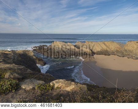 View Of Empty Praia Dos Buizinhos Sand Beach With Ocean Waves And Sharp Rock And Cllifs At Wild Vice