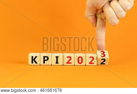 Kpi, Key Performance Indicator Symbol. Businessman Turns Wooden Cubes With Words Kpi 2022 And Kpi 20
