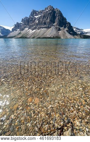Bow Lake With Colorful Pebbles And Rocks In Banff National Park