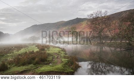 Stunning Autumn Landscape Sunrise Image Looking Towards Borrowdale Valley From Derwentwater In Lake 