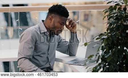 Shocked Young Businessman Working On Laptop Feeling Frustrated Stressed By Problem Despair Unsuccess