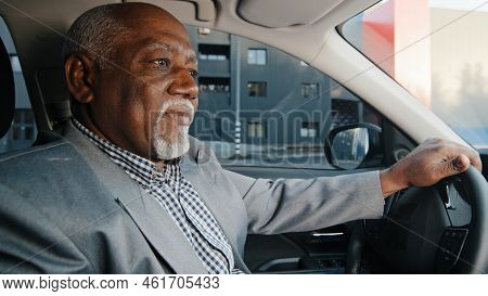 Elderly African American Businessman Driving Automobile On Roadway Experienced Confident Driver Care
