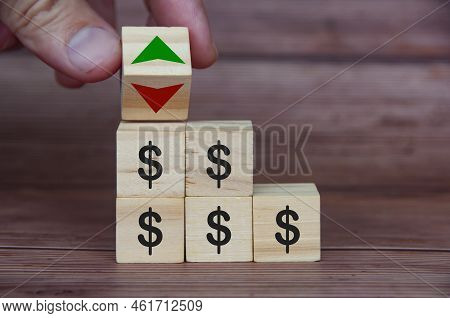Currency Fluctuation With Dollar Sign On Wooden Blocks. Currency Fluctuation And Wealth Concept.