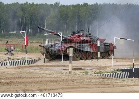 Alabino, Russia - August 19, 2022: Tank T-72b3 Of The Mongolian Team Runs The Tank Biathlon Track