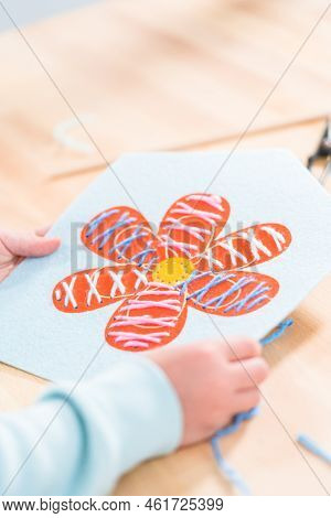 Little Girl Learning How To Sew With Sewing Craft Kit For Kids.