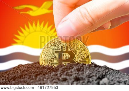 Legalization Of Bitcoin In Kiribati. Planting Grain Bitcoin In The Ground On The Background Of The F