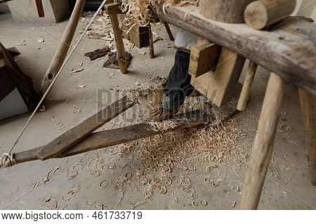 Shallow Depth Of Field (selective Focus) Details With A Craftsman Using An Ancient Roman Woodturning