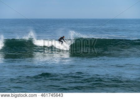 Surfer Riding Waves