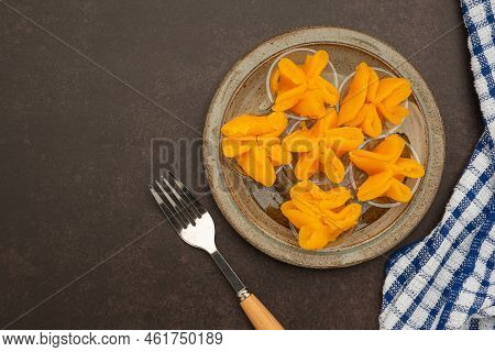 Pinched Gold Egg Yolks Or Khanom Thong Yip In The Thai Language Are Placed On A Plate With Cutlery A