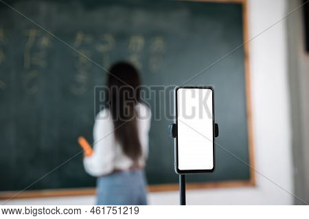Back To School Online Class. Asian Teacher Teach On Board While Have Blackboard Lecture Online Throu