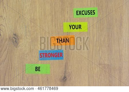 Be Stronger Symbol. Concept Words Be Stronger Than Your Excuses On Colored Paper On A Beautiful Wood
