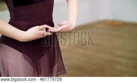 Close Up, In Dancing Hall, Young Ballerina In Purple Leotard Performs First Position Of Hands, Elega