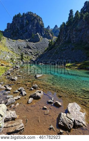 Green Colors Of Leama Lake In Its Small Valley