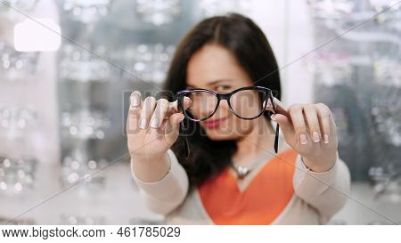 Sexy Beautiful Woman Staring At Camera. Portrait Of Smiling Female Customer Wearing Spectacles In Op