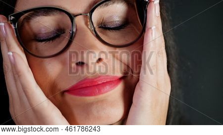 Portrait Of A Sexy Brunette Woman With Red Lips Who Eroticly And Playfully Tries On Different Pairs 
