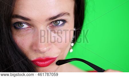 Green Background, Chromeakey. Portrait Of A Sexy Brunette Woman With Red Lips, In Stylish Glasses, S