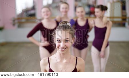 Portrait Of A Young Girl Ballet Dancer In A Lilac Ballet Leotard, Smiling, Sending An Air Kiss, Grac