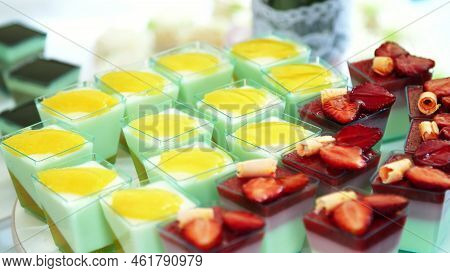 Close-up, A Variety Of Delicious Desserts, Cakes With Cream, Chocolate And Strawberries. Whipped Cre