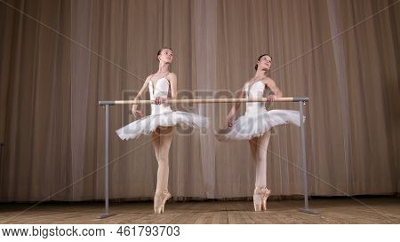 Ballet Rehearsal, In Old Theater Hall. Young Ballerinas In White Ballet Skirts, Tutus, Are Engaged A