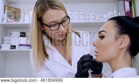 A Cosmetology Room In Clinic, Doctor Applies Anesthesia On Patients Lips, An Anesthetic Before Injec