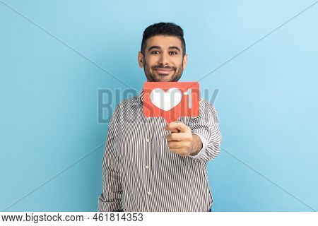 Love Interesting Content. Man Holding Out Heart Like Icon Of Social Media, Notification Button To Fo