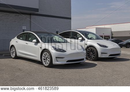 Tesla Ev Electric Vehicles On Display. Tesla Products Include Electric Cars, Battery Energy Storage