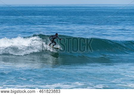Surfer Riding Waves